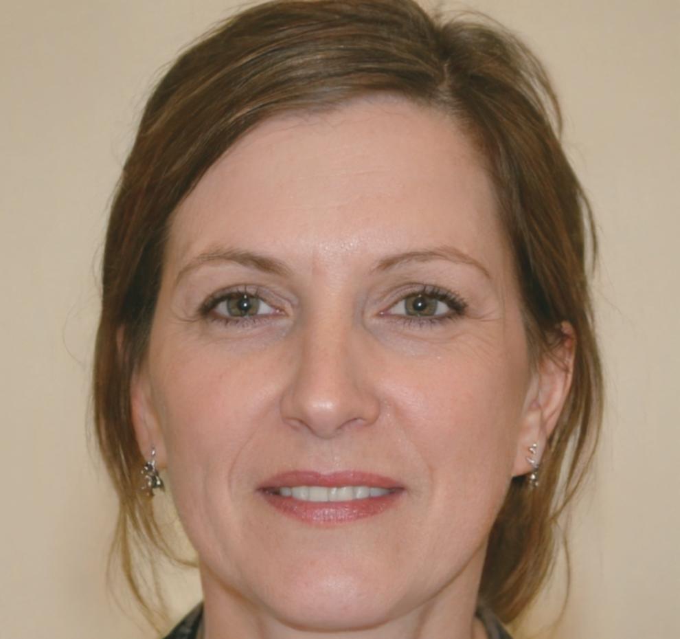 Senior financial analyst reviewing student work during mentoring session